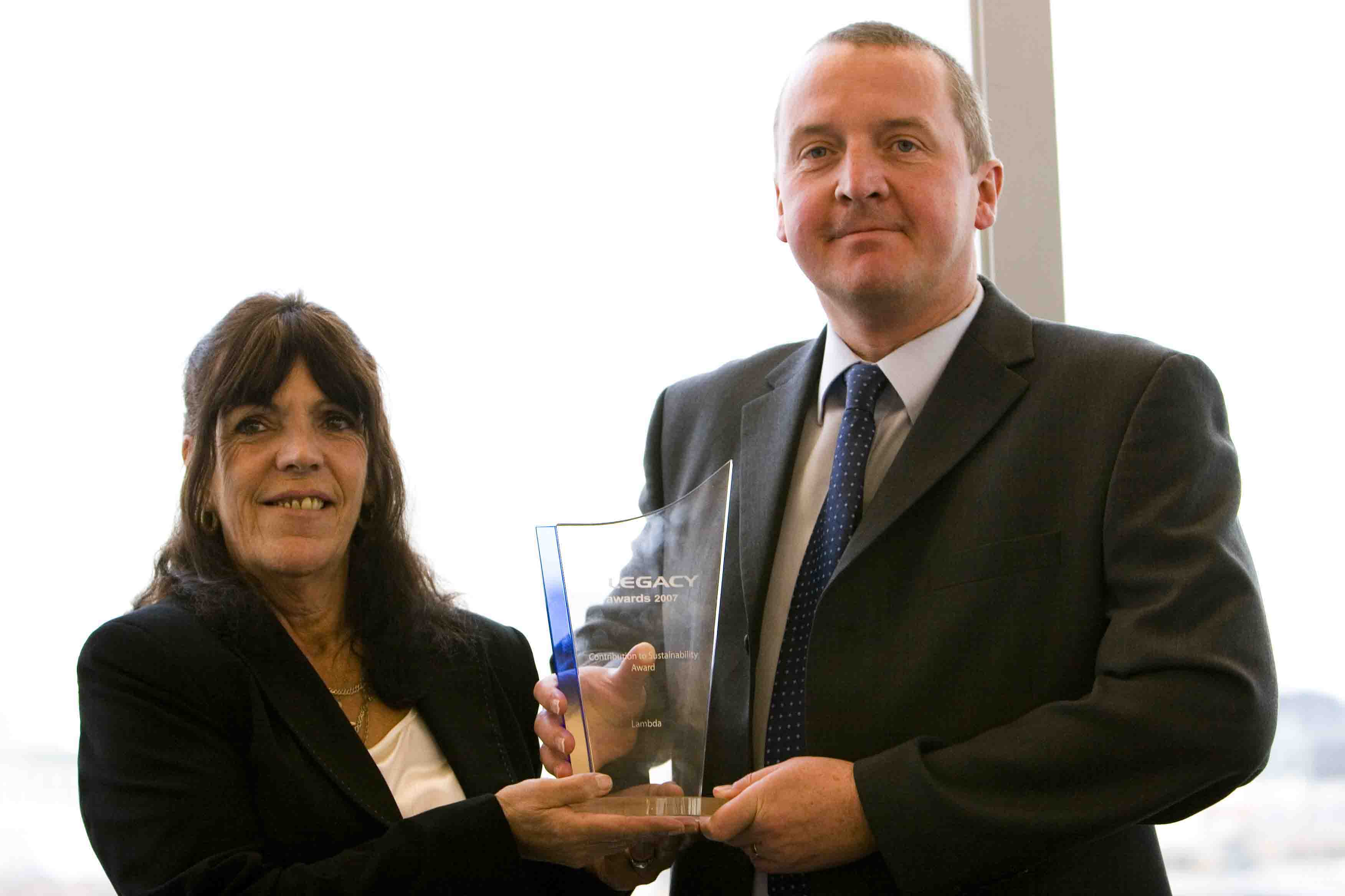 Maureen Woodger and Andy Dorr of Lambda UK collect the e-Legacy Contribution to Sustainability Award.